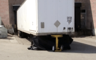 AutoStand Plus holding up a trailer with collapsed landing gear