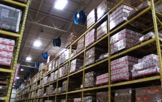 Rack mounted high velocity fan in commercial warehouse