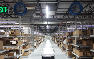 High velocity cooling fan yoke mount in commercial warehouse