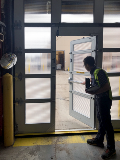 person exiting High-Speed Springless Polycarbonate Door
