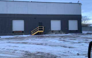Before Sectional overhead doors with no windows rusted loading dock levelers plates calgary alberta