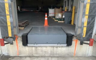 After Steel face dock bumpers and Blue Giant hydraulic loading dock leveler plate gray