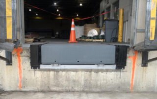 After Steel face dock bumpers and Blue Giant hydraulic loading dock leveler plate gray