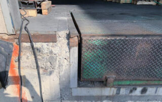 Before Rusted loading dock leveler plate and missing dock bumpers calgary alberta