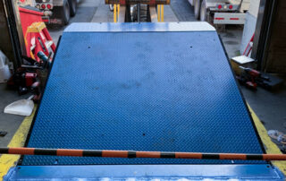 After replacement hydraulic dock leveler burnaby BC warehouse inside dock raised weather seal stripping