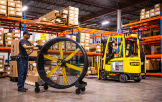 BAF Big Ass Fans directional barrel fan Sidekick man pushing moving in warehouse