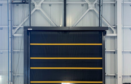 whitby warehouse 16'x16' bug screen door in front of overhead sectional door