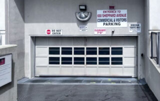 before toronto large wide parking garage wood sectional door outside closed