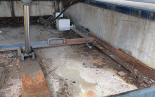 Etobicoke warehouse Before Rusted and worn exterior dock leveler debris rust dirt in dock pit
