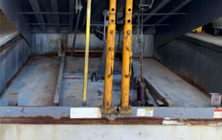 mechanical dock leveler plate loading dock preventive maintenance PMP During - Position 1 – Dock - Cleaned pit but still missing toe guards.