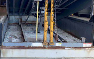 mechanical dock leveler plate loading dock preventive maintenance PMP Before - Position 1 – Dock - Debris in pit and missing toe guards.